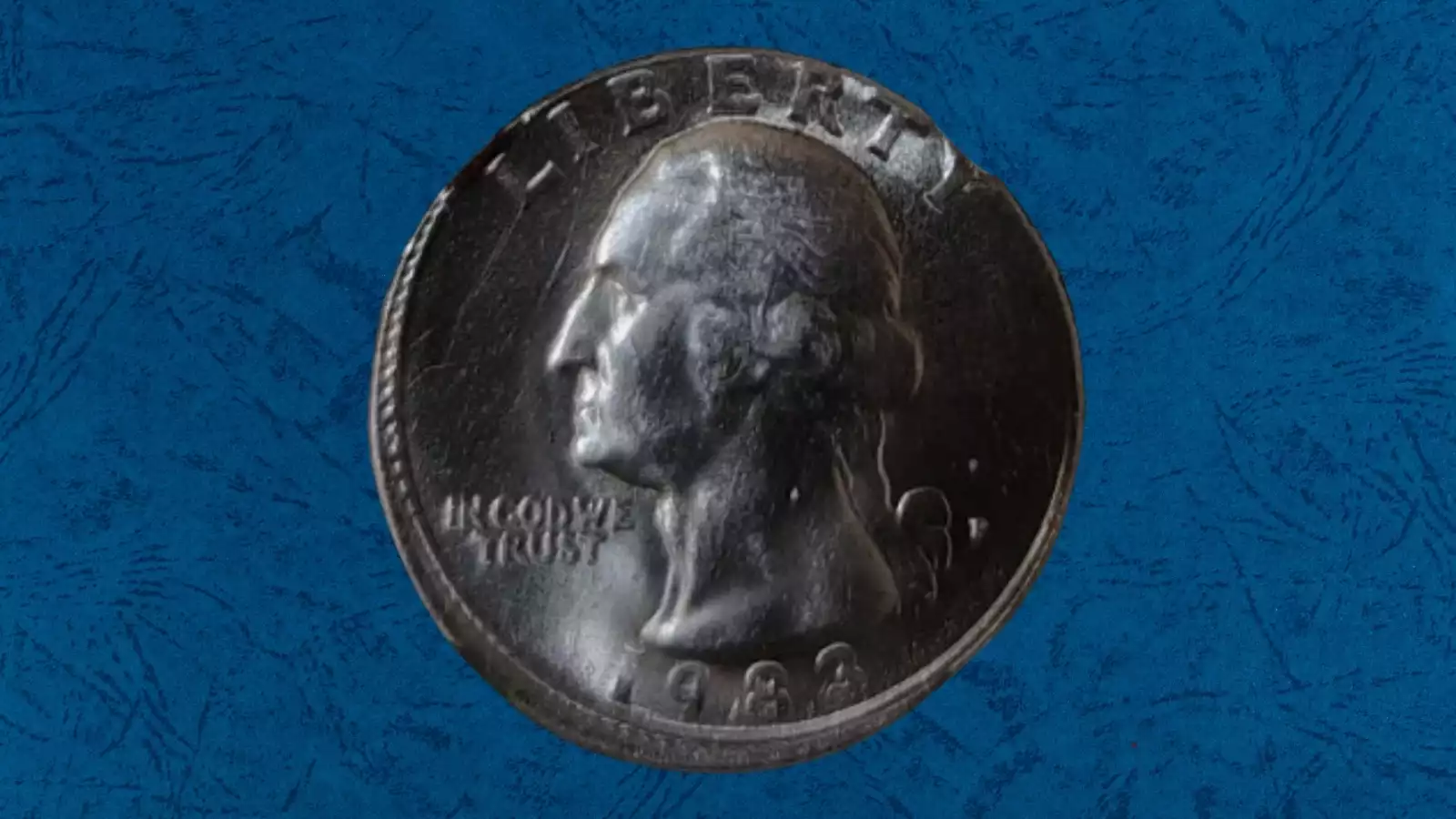 1983 Washington quarter broadstrike error showing wider diameter with smooth unreeded edge compared to standard reeded quarter edge